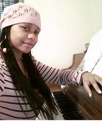 Singer Songwriter A'Ishah Songstress, student of Sherry Wilson Butler