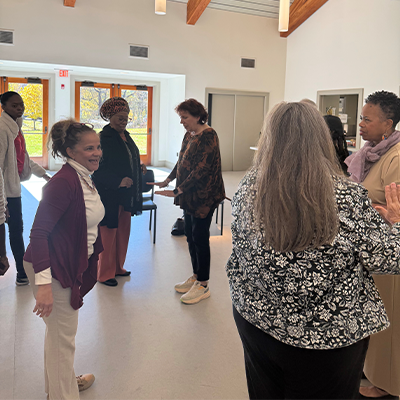 Master vocal coach instructing singers for the singers circle event